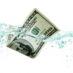 Money Dropping into Water